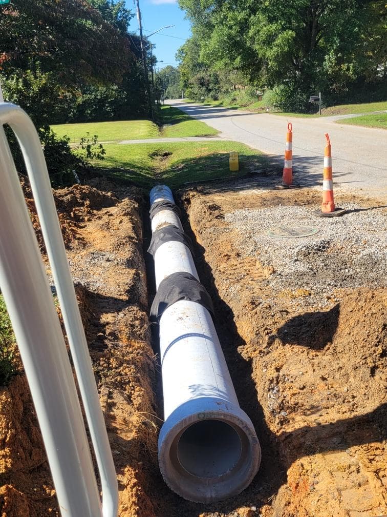 Storm drain mainline pipe setting